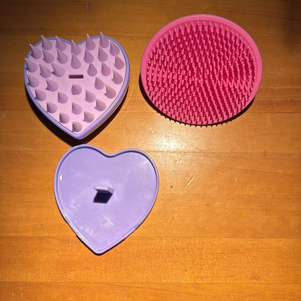 ANTHROPOLOGIE Face buffer (pink) and scalp massager (purple). Excellent quality.